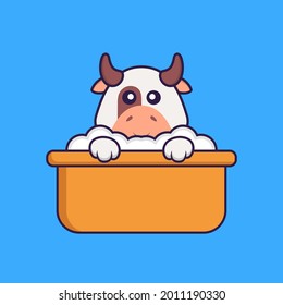 Cute cow taking a bath in the bathtub. Animal cartoon concept isolated. Can used for t-shirt, greeting card, invitation card or mascot.