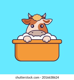 Cute cow taking a bath in the bathtub.