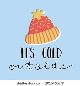 Cute and cozy winter card design. Warm hand knitted pompom hat and hand lettering It's cold outside. Hand-drawn vector isolated illustration in cartoon style. 