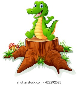 Cute crocodile posing on tree stump