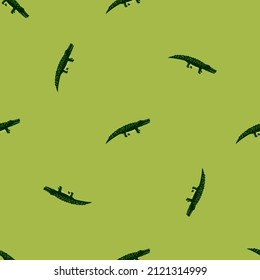 Cute crocodiles seamless pattern.Funny animals background. Repeated texture in doodle style for fabric, wrapping paper, wallpaper, tissue. Vector illustration.