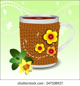 Cute cup in a sweater decorated with flowers