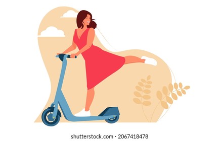 A cute dark-haired girl in a red dress rides a scooter, lifts her leg and smiles. Background landscape. The concept of active pastime, outdoor activities, environmentally friendly transport.