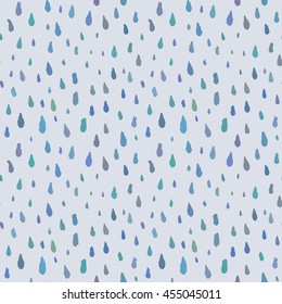 Cute decorative seamless pattern with raindrops. Hand drawn ink different sizes blue drops with rough edges on light grey background. Endless ornament for childish decoration, cloth or wrapping