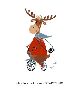 Cute deer riding a bicycle. Funny reindeer in red sweater with camera is travelling by bike. Happy cartoon scandinavian animal. Hand drawn vector illustration for kids, isolated on white. Flat design