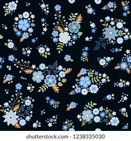 Cute ditsy seamless floral pattern with groups of blue flowers on black background. Fashion design. Print for fabric. Vector illustration.