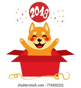 Cute dog inside open red surprise gift box celebrating 2018 year happy