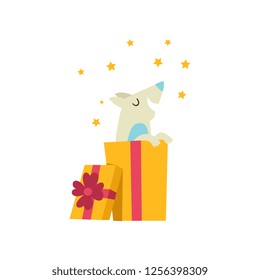 Cute dog sitting in a gift box, funny cartoon animal character at birthday party vector Illustration