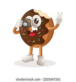 Cute donut mascot taking photo with camera. Perfect for food store, small business or e-Commerce, merchandise and sticker, banner promotion, food review blog or vlog channel
