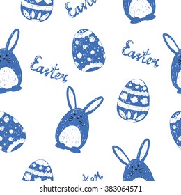 Cute doodle bunnies and eggs. Easter seamless pattern. Holiday background in blue and white. 