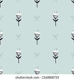 Cute doodle flowers and little bows isolated on a light blue background. Vector seamless pattern. Simple outline design. Hand drawn backdrop for textile, wrapping paper, wallpaper.