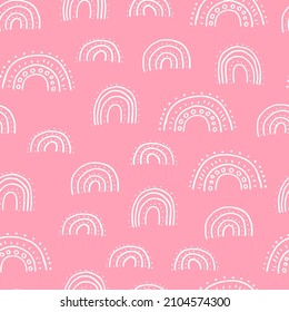 Cute doodle seamless pattern with rainbows. Hand drawn vector rainbow pattern on pastel-ink background.