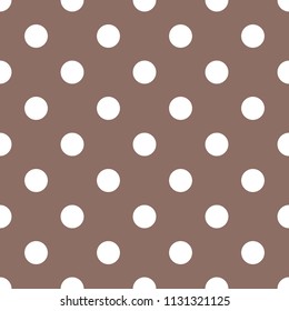 Cute dotted seamless pattern in brown and white colors