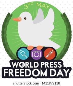 Cute dove over a green button with wreath, holding representative journalism icons for radio, written media and graphics to celebrate World Press Freedom Day in May 3.