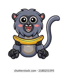 Cute dusky leaf monkey cartoon holding a banana