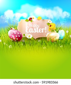 Cute Easter background with colorful eggs and paper label in front of spring landscape