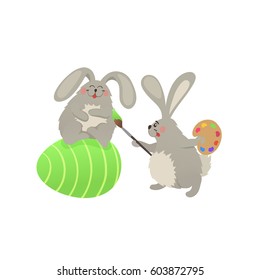 Cute Easter bunnies coloring egg. Fun illustration of rabbits with Happy easter text isolated on white background.