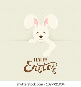 Cute Easter bunny behind a banner with lettering Happy Easter, illustration.