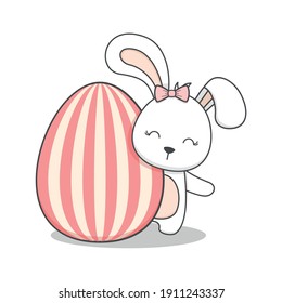 cute easter bunny behind an egg