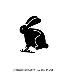 Cute easter bunny black icon, vector sign on isolated background. Cute easter bunny concept symbol, illustration 