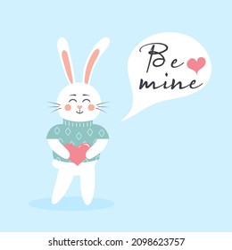 Cute Easter Bunny Boy In A Sweater With Heart. Scandinavian Happy Baby Rabbit With Text: Be Mine In A Speech Bubble.  Valentine's Day Postcard. 