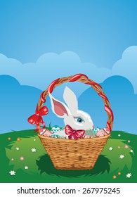 Cute Easter bunny with colorful basket of eggs on spring lawn.