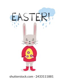 A cute Easter bunny holds a colored egg in his paws. Rabbit in a spring raincoat and boots. Cloud with raindrops. Easter Egg. Christ is risen. Horizontal poster, Easter card, Happy Easter banner