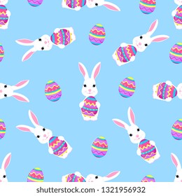 Cute Easter bunny holds paschal egg in its paws seamless pattern.