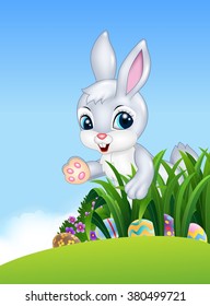 Cute Easter bunny looking for colorful Easter eggs