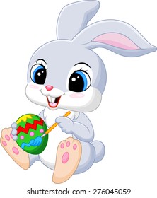 Cute Easter Bunny painting an egg 