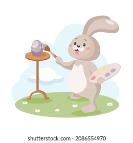 Cute Easter bunny paints eggs before the holidays. Preparation for the holiday. Happy Easter. Vector illustration in cartoon style isolated on a white background