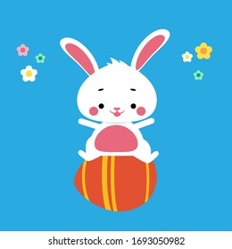 Cute easter bunny sitting on a giant egg celebrating holday