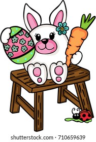 Cute Easter bunny sitting on wooden stool
