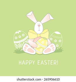 Cute easter hare on a lawn. The easter greeting card.