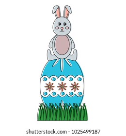 cute easter rabbit sitting on a big decorated egg
