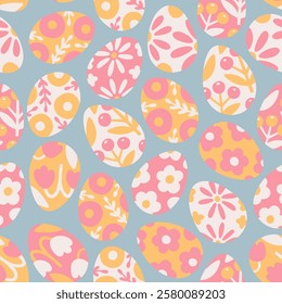 Cute Easter seamless pattern. Happy Easter. Eggs decorated with flowers on blue background. Vector illustration