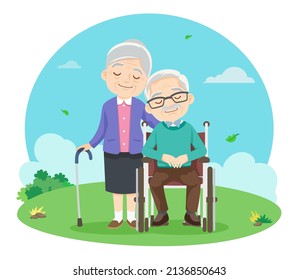 cute elderly couple sitting on wheelchair Relax in the park