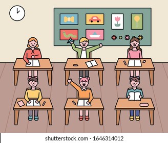 Cute elementary school children sit at classroom desks. Class time. flat design style minimal vector illustration.