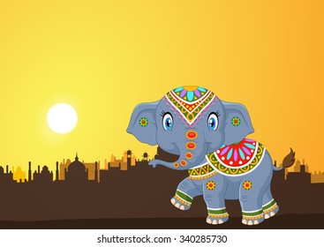 Cute elephant mascot wearing traditional costume on the sunset background