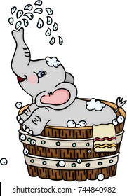 Cute elephant taking a bath in wooden tub
