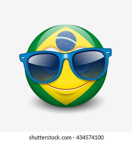 Cute emoticon isolated on white background wearing blue sunglasses with Brazil flag motive - smiley - vector illustration