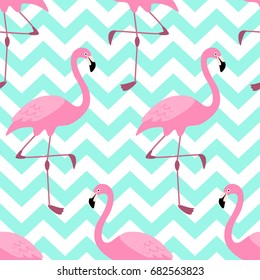 Cute exotic tropical seamless background with pink flamingos