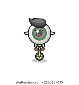 The cute eyeball character is riding a circus bike , cute style design for t shirt, sticker, logo element