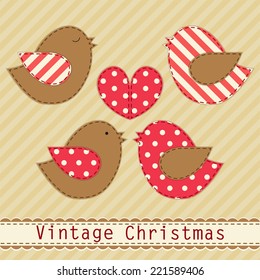 Cute fabric paradise birds as retro fabric applique in shabby chic style in traditional Christmas colors