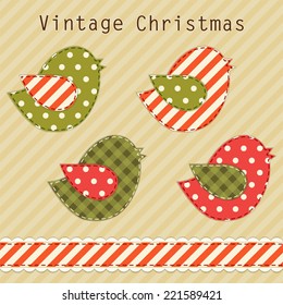 Cute fabric paradise birds as retro fabric applique in shabby chic style in traditional Christmas colors
