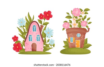 Cute fabulous houses among summer flowers set vector illustration