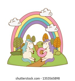 cute fairytale unicorns with rainbow in the field