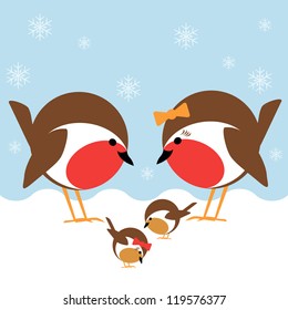 a cute family of robin redbreasts in the snow