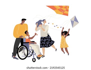 Cute family with son in wheelchair flying kites. Active life of people with disabilities