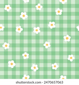 Cute fashion seamless pattern in style of picnic. Scottish tartan Vichy plaid with ditsy flowers, print for fabric, wrapping paper, package, banner, card. Classic textile print vector background.